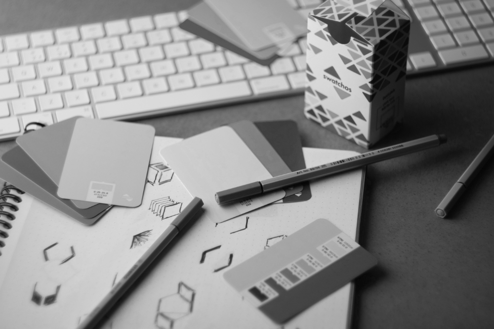 Logo development sketches and identity design work